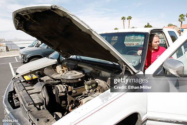 United Suzuki Mitsubishi service manager Kevin Blackwell runs the engine of a 1993 Chevrolet Silverado 1500 pickup truck for the last time after...