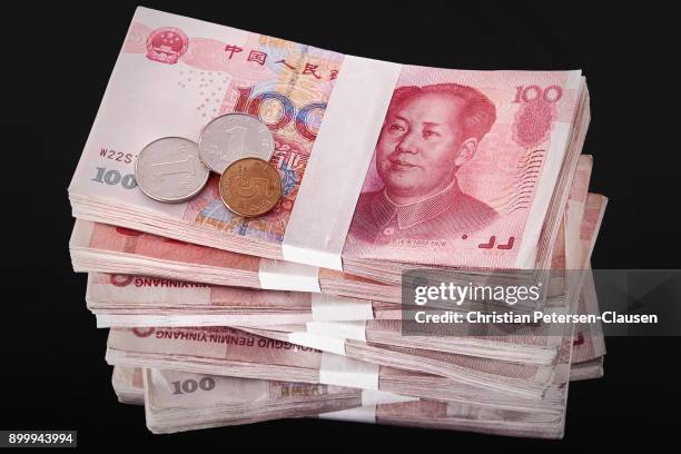 stack of chinese rmb paper currency - chinese currency stock pictures, royalty-free photos & images