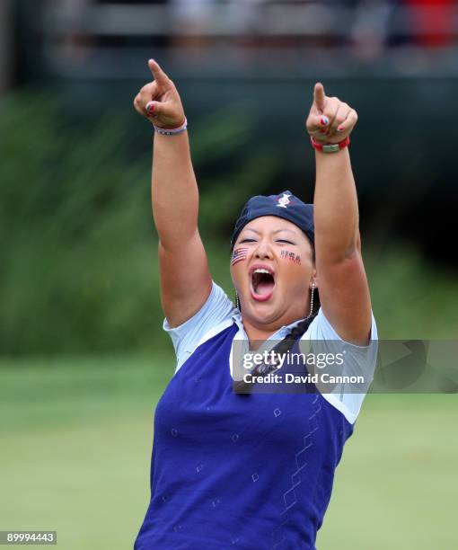 Christina Kim of the USA celebrates winning her match with Natalie Gulbis on the 16th green during the Friday afternoon foursome matches at the 2009...