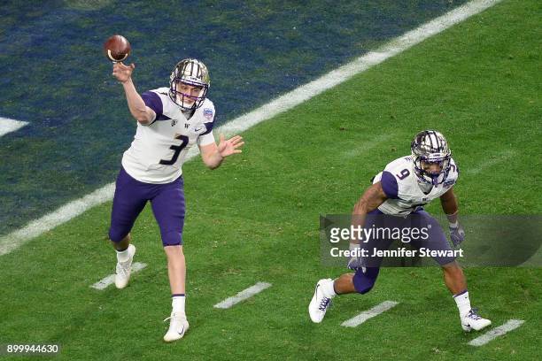 Quarterback Jake Browning of the Washington Huskies makes a pass alongside running back Myles Gaskin during the first half of the PlayStation Fiesta...