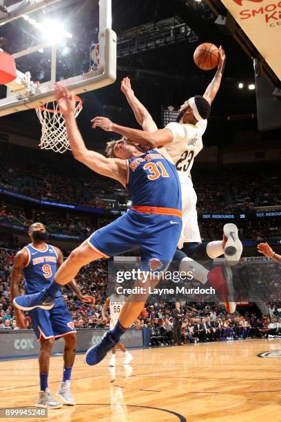 Anthony Davis of the New Orleans Pelicans goes to the basket against Ron Baker of the New York Knicks on December 30, 2017 at the Smoothie King...