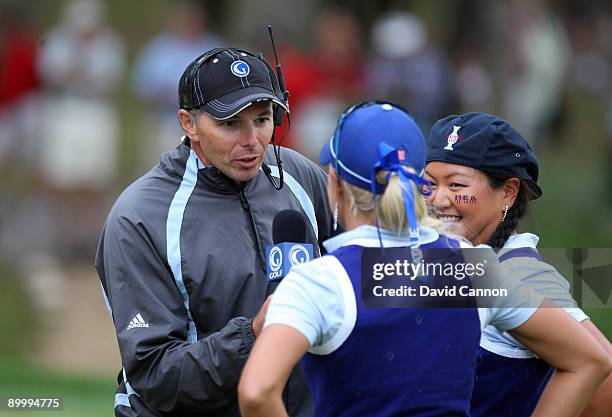 Phillip Parkin of Wales the Golf Channel on course commentator interviews Kristina Kim and Natalie Gulbis after they had won on the 16th green during...