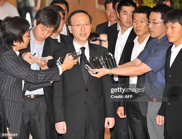 South Korea's Unification Minister Hyun In-Taek talks to the media before a meeting with Kim Yang-Gon, North Korea's Department Director of the...