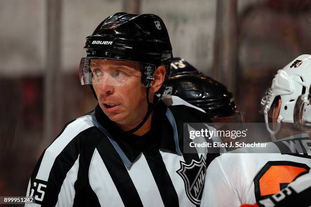 Linesmen Pierre Racicot keeps the peace between the Florida Panthers and the Philadelphia Flyers at the BB&T Center on December 28, 2017 in Sunrise,...