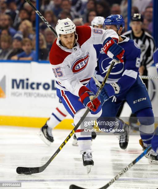 Andrew Shaw of the Montreal Canadiens shoots against the Tampa Bay Lightning during the third period at Amalie Arena on December 28, 2017 in Tampa,...