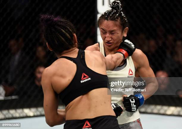 Cynthia Calvillo punches Carla Esparza in their women's strawweight bout during the UFC 219 event inside T-Mobile Arena on December 30, 2017 in Las...