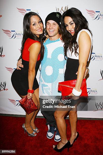 Nikki Bella, Louie Vito and Brie Bella arrive to WWE's Summer Slam Kickoff Party held at h.wood on August 21, 2009 in Hollywood, California.