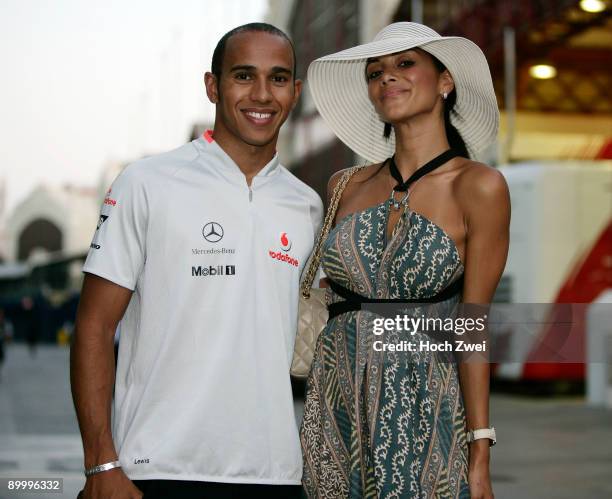 Lewis Hamilton of Great Britain and McLaren Mercedes and his girlfriend Nicole Scherzinger of the Pussycat Dolls walk in the paddock following...