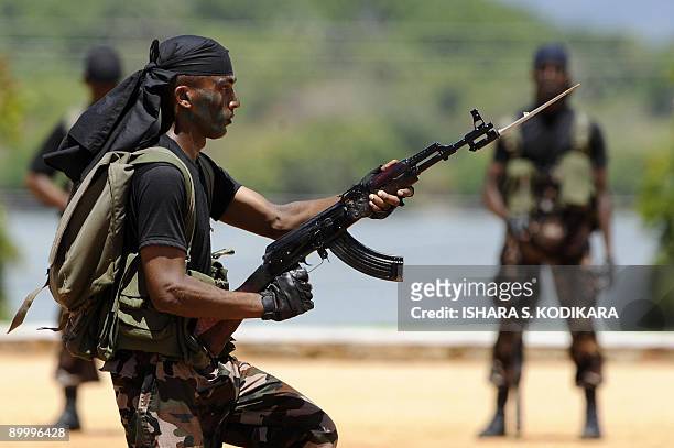 Sri Lankan Air Force troops display their commando skills during a passing out ceremony of 329 men and officers in the north-eastern town of...