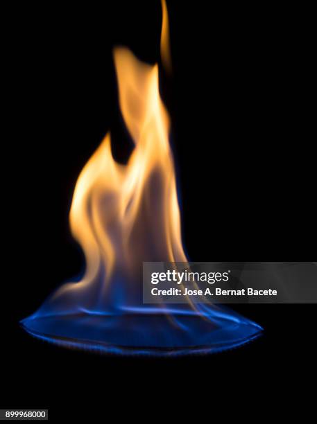 full frame of flames and natural fire, on a black background. - flamme freisteller stock-fotos und bilder