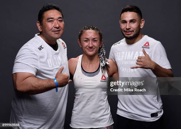 Carla Esparza poses for a portrait backstage with her team after her victory over Cynthia Calvillo during the UFC 219 event inside T-Mobile Arena on...