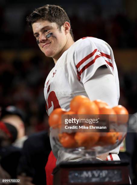 Alex Hornibrook of the Wisconsin Badgers celebrates after winning the MVP trophy of the 2017 Capital One Orange Bowl against the Miami Hurricanes...
