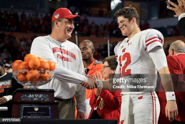 Head coach Paul Chryst and Alex Hornibrook of the Wisconsin Badgers celebrates after winning the 2017 Capital One Orange Bowl against the Miami...