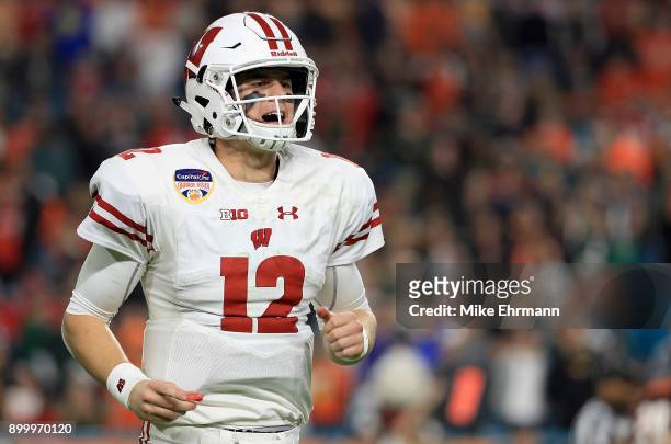 Alex Hornibrook of the Wisconsin Badgers looks on during the 2017 Capital One Orange Bowl against the Miami Hurricanes at Hard Rock Stadium on...