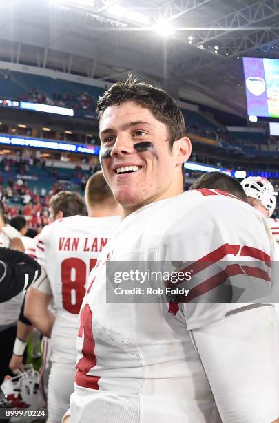 Alex Hornibrook of the Wisconsin Badgers celebrates after the 2017 Capital One Orange Bowl against the Miami Hurricanes at Hard Rock Stadium on...