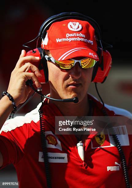 Former Ferrari F1 World Champion Michael Schumacher watches from the pitlane during the final practice session prior to qualifying for the European...