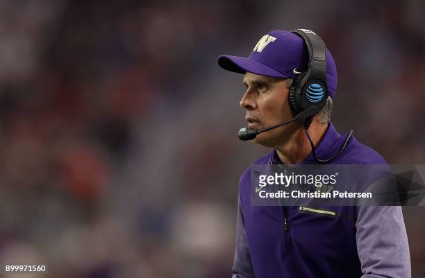 Head coach Chris Petersen of the Washington Huskies looks on from the sidelines during the second half of the Playstation Fiesta Bowl against the...