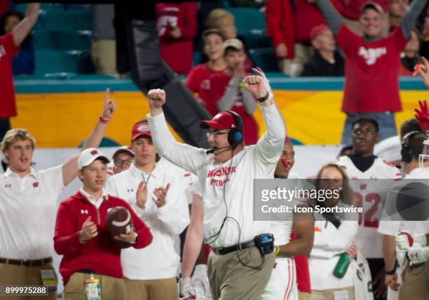 Wisconsin Badgers Head Coach Paul Chryst raises his hands in the air as he celebrates winning the Capital One Orange Bowl college football game...