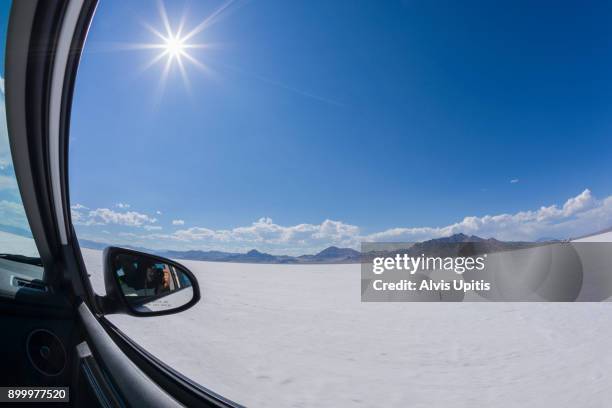 photographer's mirror selfie as car races across bonneville salt flats, utah. - wendover stock pictures, royalty-free photos & images