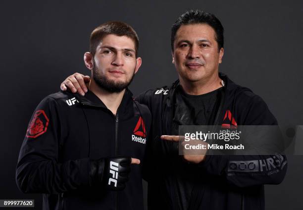 Khabib Nurmagomedov of Russia poses for a portrait backstage with coach Javier Mendez after his victory over Edson Barboza during the UFC 219 event...