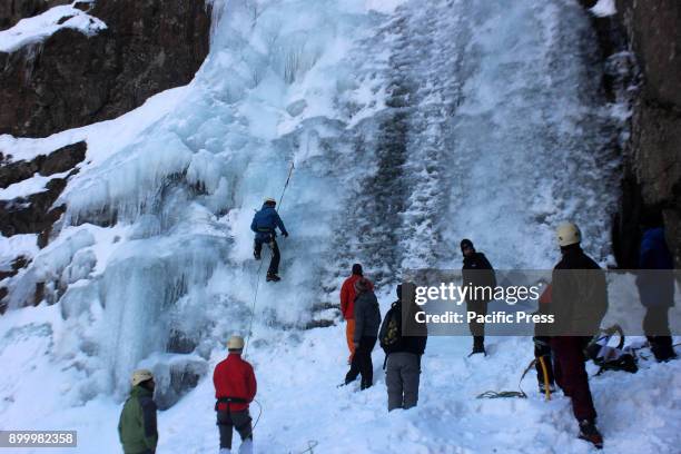 The ice climbers scale an ice wall at Chandanwari in Pahalgam.