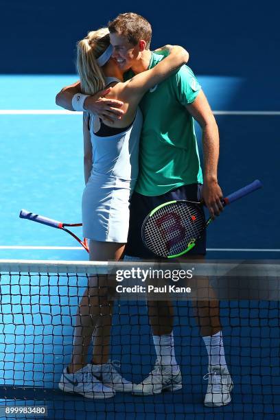 Eugenie Bouchard and Vasek Pospisil of Canada celebrate winning their mixed doubles match against Daria Gavrilova and Thanasi Kokkinakis of Australia...