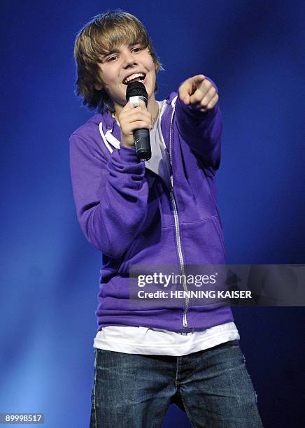 Canadian singer Justin Bieber performs on stage during the event "The Dome" in Cologne, western Germany on August 21, 2009. AFP PHOTO DDP/ HENNING...