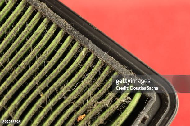 dirty air filter from a combustible motor - umweltschutzbeauftragter stock-fotos und bilder