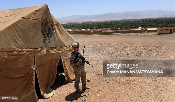 Soldier from the 1st Platoon Alpha 3-71 Cavalry stand guard in front of a tent outside a school compound during a mission in the Baraki Barak...