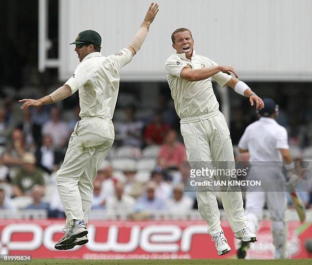 Australia's Simon Katich celebrates running out England's Matt Prior bowled by Australia's Peter Siddle during England's 2nd Innings on the third day...