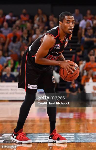Bryce Cotton of the Wildcats looks to pas the ball during the round 12 NBL match between the Cairns Taipans and the Perth Wildcats at Cairns...