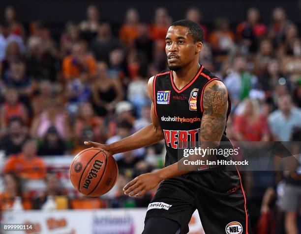 Bryce Cotton of the Wildcats looks to pas the ball during the round 12 NBL match between the Cairns Taipans and the Perth Wildcats at Cairns...