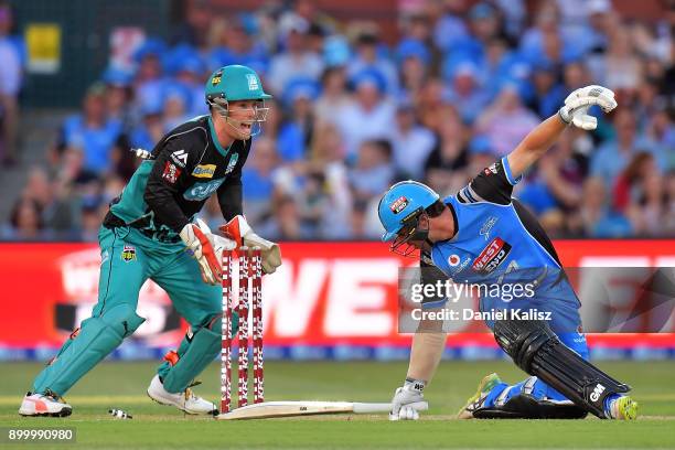Travis Head of the Adelaide Strikers is bowled out by Yasir Shah of the Brisbane Heat during the Big Bash League match between the Adelaide Strikers...