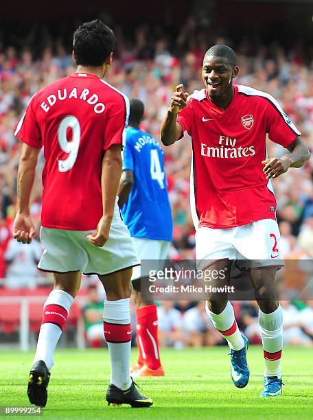 Abou Diaby of Arsenal celebrates his goal with teammate Eduardo during the Barclays Premier League match between Arsenal and Portsmouth at the...