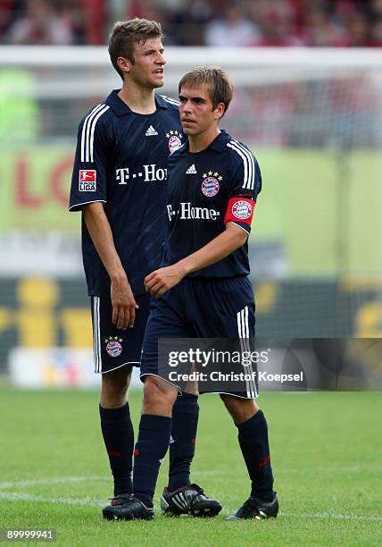 Thomas Mueller and Philipp Lahm of Bayern look dejected after losing 1-2 the Bundesliga match between FSV Mainz 05 and FC Bayern Muenchen at Bruchweg...