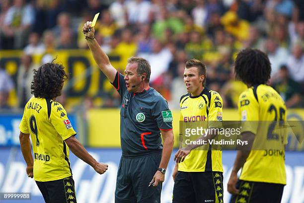 Nelson Valdez of Dortmund is booked by a yellow card from referee Helmut Fleischer during the Bundesliga match between Borussia Dortmund and VfB...