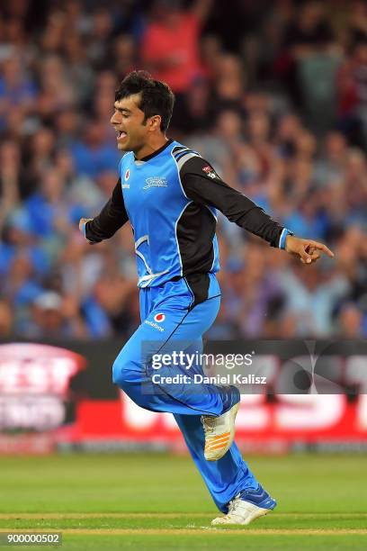 Rashid Khan of the Adelaide Strikers celebrates after taking the wicket of Chris Lynn of the Brisbane Heat during the Big Bash League match between...