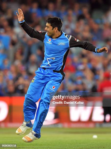 Rashid Khan of the Adelaide Strikers celebrates after taking the wicket of Chris Lynn of the Brisbane Heat during the Big Bash League match between...