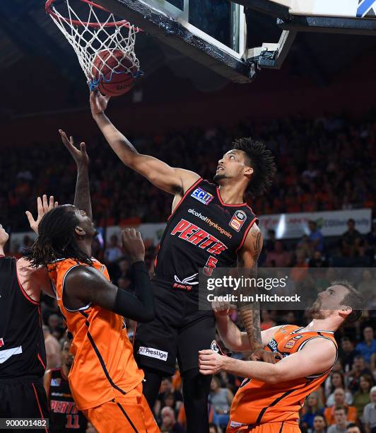 Jean-Pierre Tokoto of the Wildcats attempts to re-gather the ball during the round 12 NBL match between the Cairns Taipans and the Perth Wildcats at...