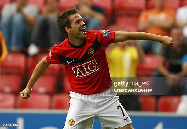 Michael Owen of Manchester United celebrates after scoring the 4:0 goal during the Barclays Premier League match between Wigan Athletic and...