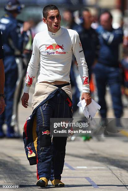 Sebastien Buemi of Switzerland and Scuderia Toro Rosso walks in the pitlane during qualifying for the European Formula One Grand Prix at the Valencia...