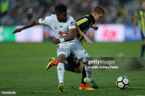 Roy Krishna of the Phoenix contests the ball against Kye Rowles of the Mariners during the round 13 A-League match between the Central Coast Mariners...