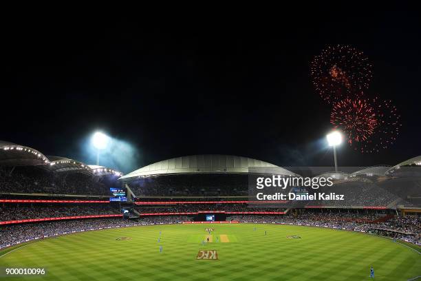 General view of play as fireworks can be seen for new year's eve celebrations during the Big Bash League match between the Adelaide Strikers and the...