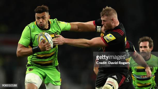 Luther Burrell of Northampton holds off George Merrick during the Aviva Premiership Big Game 10 match between Harlequins and Northampton Saints at...