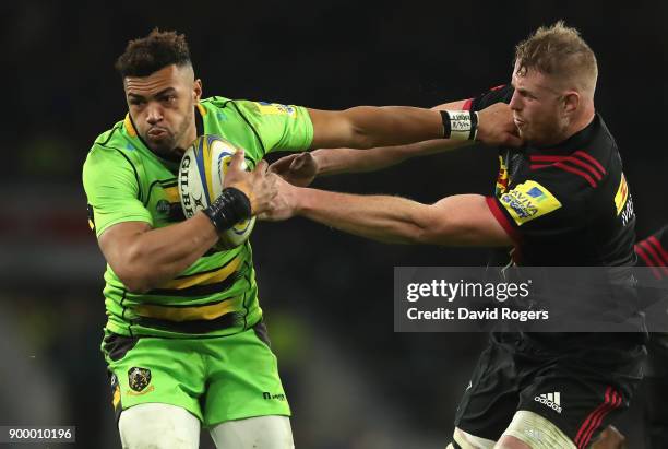 Luther Burrell of Northampton holds off George Merrick during the Aviva Premiership Big Game 10 match between Harlequins and Northampton Saints at...