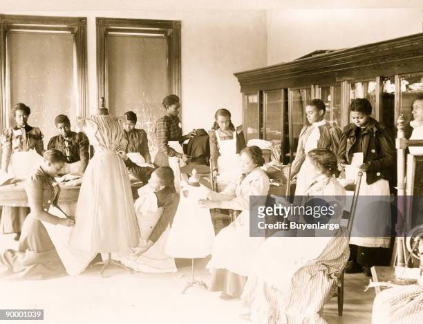 Young women cutting and fitting clothing in class at Agricultural and Mechanical College, Greensboro, N.C.