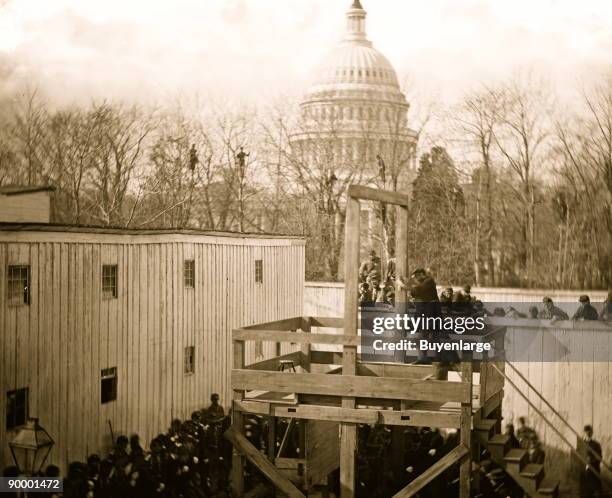 Washington, D.C. Soldier springing the trap; men in trees and Capitol dome beyond