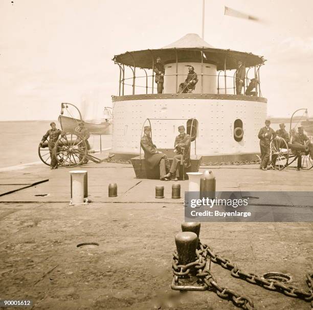 Charleston Harbor, S.C. Deck and officers of U.S.S. Monitor Catskill; Lt. Comdr. Edward Barrett seated on the turret