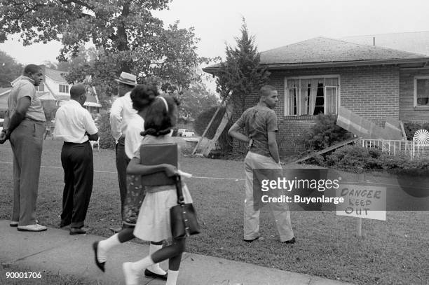 African Americans viewing the bomb-damaged home of Arthur Shores, NAACP attorney, Birmingham, Alabama