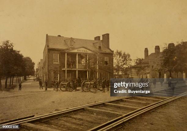 Union soldiers and artillery in front of a Washington D.C. Hotel near railroad tracks leading to Long Bridge.